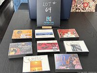 Eight Readers Digest music compilation CDs arranged on a table with cover art showing various artists and genres.