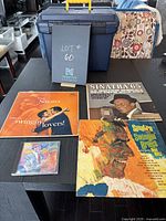 Photo showing three Frank Sinatra vinyl albums and one CD on a table.