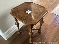 Side angle view showing turned legs and octagonal parquet inlay top