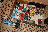 Two open boxes showing multiple 1:24 scale die-cast Franklin Mint model cars