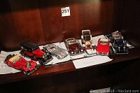 Overview of seven Franklin Mint Mercedes-Benz precision models displayed on shelf