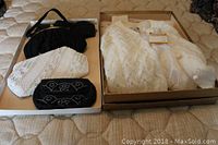 Overview of evening purses and the virgin wool sweater in box
