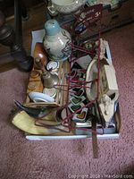 Overview of assorted items in tray on carpet