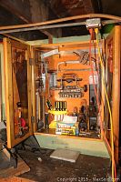 Open cabinet showing full contents mounted on back panel