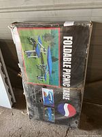 Boxed Pepsi foldable picnic table with images and branding on the box