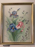 Framed watercolour painting showing irises with purple and pink flowers and surrounding greenery.