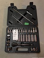 Full view of the open tote case showing organized socket set including wrench, extensions, and sockets.