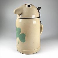 Front view showing the Dooley King design with large nose and green shamrock on stein body