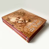 Slipcase holding two hardcover books featuring Leonardo da Vinci artwork and title on front.