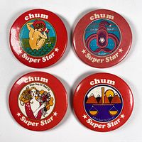 Four vintage Chum Super Star astrology pinback buttons featuring Scorpio, Libra, Aquarius, and Virgo signs on a white background.