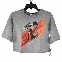 Front view of heather gray cropped sweatshirt with half sleeves, showing printed graphic of Sonny and Cher and text 'the beat goes on'.