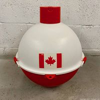 Red and white spherical cooler with a Canadian flag sticker on front.