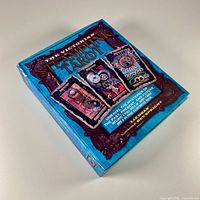 Closed view of the Victorian Steampunk Tarot box with title and cover art showing three sample cards.