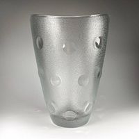 Front view of frosted glass vase showing polka dots and matte texture.