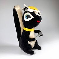 Front left angle view of the vintage Dakin Dream Pets skunk plush doll with flower hat and yellow collar, holding a spoon.