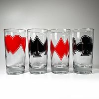 Four clear highball glasses featuring playing card suits (heart, spade, diamond, club) in red and black with white outlines shown side-by-side