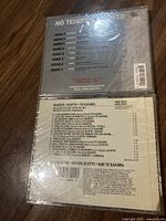 Back cover of No Tenors Allowed opera CD showing track listing and artists