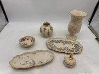 Six Lenox porcelain collection items including 2 candy plates, 2 vases, candy bowl, and trinket box arranged on white surface