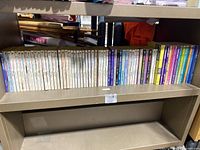 Full shelf of 40 Nancy Drew and related mystery books arranged side by side with visible spines, showing titles and series numbers