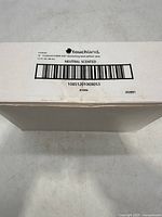 White carton box showing label for Touchland Power Mist Moisturizing Hand Sanitizer including product size, scent, and barcode.