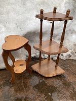 Full view of the two wooden stands showing their size, shape, and design details.