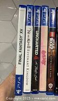 Side view of PS4 game cases showing titles: Final Fantasy XV, Nioh Mortal Remnant Kingdom, Uncharted The Lost Legacy, LEGO Star Wars The Skywalker Saga, Star Wars Battlefront II