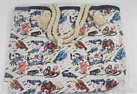 Front side view of canvas beach bag showing colorful underwater creature print and rope handles with knots.