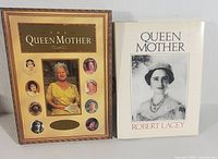Photo of both books side by side, showing covers. One is a book by Robert Lacey with a white cover and black and white photo of the Queen Mother. The other is a Royal Family Collectibles book with gold and multiple portraits.