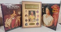 Three items together: two hardcover books and a framed collage related to Queen Victoria and Queen Mother.