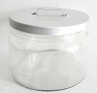Front and side view of clear glass canister showing the curved glass body and white metal lid with handle