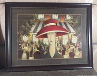 Framed print in full view on floor against wall, showing entire artwork and frame.