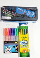Photo showing 3D hypotrochoid art set metal tin with colorful design and pair of 3D glasses on top, Jot ballpoint pens in a pack of 8 colors, and Crayola washable markers box with 5 colors.