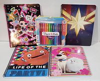Four colorful spiral-bound coil notebooks with lined pages, featuring themed covers and a pack of bright Paper Mate Flair felt tip pens in the center.