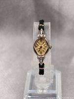 Front view of the vintage ladies Bulova watch showing dial and strap.