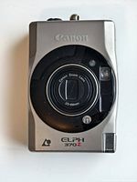 Front view of Canon Elph 370Z APS film camera showing lens and body labeling.
