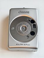 Front view showing Canon ELPH LT260 lens and body design in silver finish