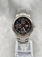 Front view of Casio Edifice multifunction watch showing black dial with three sub-dials and stainless steel bracelet.