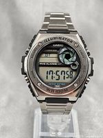 Front view of the Casio MWD-100H digital watch showing the display and metal bezel with button labels.