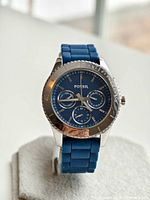 Front view of Fossil diver style watch showing blue dial, subdials, and silver bezel