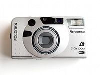 Front view of silver Fujifilm Fotonex 310ix Zoom film camera showing lens, flash, brand and model markings.