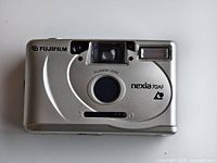 Front view of Fujifilm Nexia 70AF camera showing lens, flash, and viewfinder.