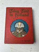Front cover of the book with title and illustration of a girl in traditional Dutch dress.
