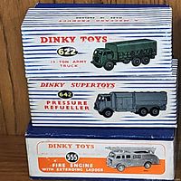 Box showing Dinky Toys models 622 Army Truck, 642 Pressure Refueller, and 555 Fire Engine