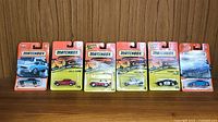 Six Matchbox cars in original blister card packaging, front view showing cars and packaging graphics.