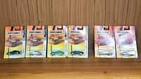 Wide shot of all five Matchbox sports cars in sealed blister packs showing front of cards and vehicles.