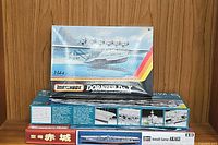 Front view of stacked model kit boxes: Matchbox 1:144 Dornier Do-X on top, Hasegawa Akagi under it