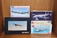 Four boxed airplane model kits arranged showing front artworks and titles.