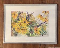 Framed watercolour painting showing entire artwork and frame on wood floor surface.