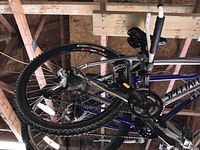 Side view showing silver and blue Specialized frame and rear wheel assembly