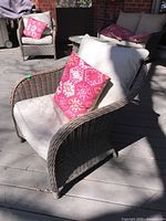 Front three-quarter view showing cushions and accent pillow